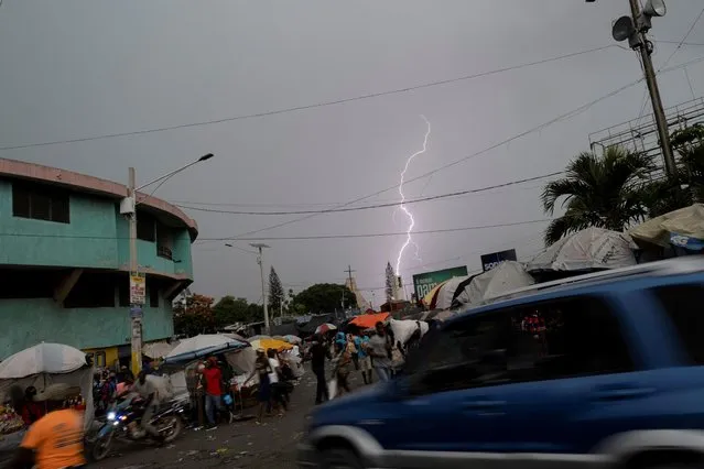 A lightning is seen striking the tower of a church, at a Petion-Ville street market in Port-au-Prince, Haiti on July 24, 2021. (Photo by Ricardo Arduengo/Reuters)