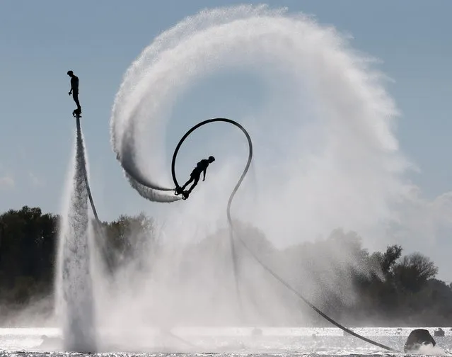 A flyboard show as part of the All-Russian jet ski competition on Lake Staraya Kuban in Krasnodar, Russia on October 23, 2021. (Photo by Dmitry Feoktistov/TASS)