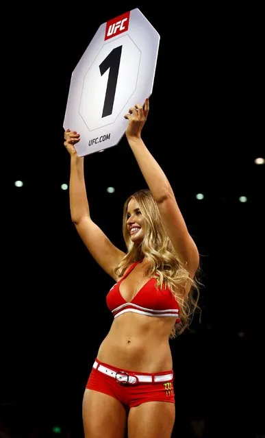 Mixed Martial Arts, Ultimate Fighting Championship (UFC) Fight Night, Lightweight Bout, Brisbane Entertainment Centre, Brisbane, Australia on March 20, 2016: A ring girl displays a sign for the first round of the bout between Johnny Case and Jake Matthews. (Photo by Jason O'Brien/Reuters)
