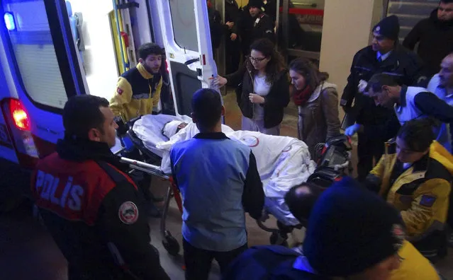 Paramedics carry a victim of a car bomb attack at a hospital in Viransehir, southeastern Turkey, late Friday, February 17, 2017. The bomb exploded near the homes of judges and prosecutors in the mainly-Kurdish town in Sanliurfa province, which borders Syria. Sanliurfa governor Gungor Azim Tuna told state-run Anadolu Agency that man in his late teens or early 20s parked the explosives-laden vehicle near the lodgings and later detonated it with a remote controlled device. (Photo by Omer Pinar/DHA-Depo Photos via AP Photo)