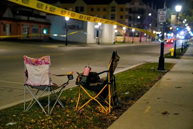 Chairs are left abandoned on Main Street after a car plowed through a holiday parade in Waukesha, Wisconsin, U.S., November 22, 2021. (Photo by Cheney Orr/Reuters)