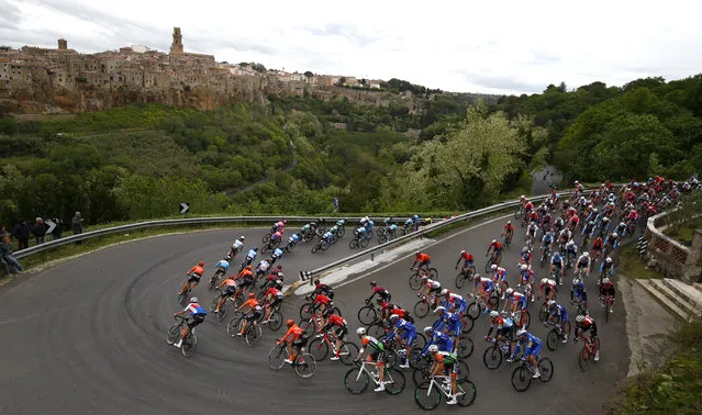 The peloton rides past Pitigliano during the stage four of the 102nd Giro d'Italia – Tour of Italy – cycle race, 235kms from Orbetello to Frascati on May 14, 2019. (Photo by Luk Benies/AFP Photo)