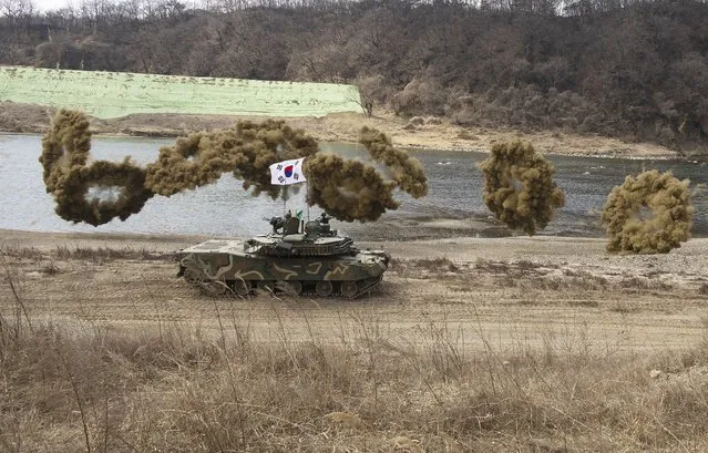 A South Korean K1E1 tank participates as South Korean and US soldiers conduct a joint river-crossing exercise in Yeoncheon, Gyeonggi province, South Korea, 20 March 2024. (Photo by Jeon Heon-Kyun/EPA)