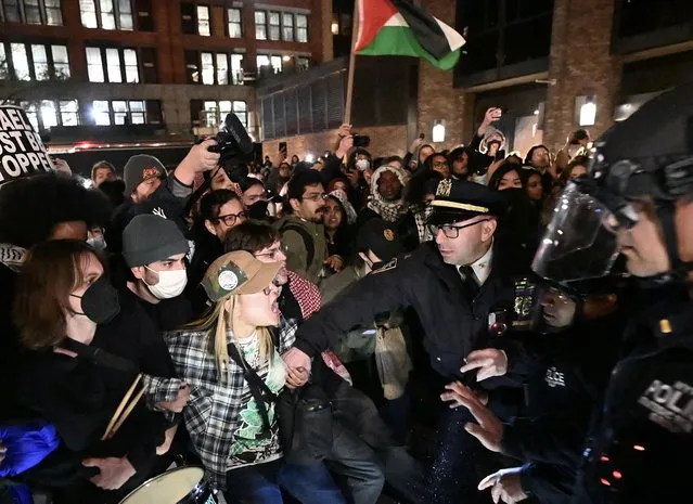 Police intervene and arrest more than 100 students at New York University (NYU) who continue their demonstration on campus in solidarity with the students at Columbia University and to oppose Israel's attacks on Gaza, in New York, United States on April 22, 2024. Pro-Palestinian protesters have launched a wave of protests on campus condemning Israel's offensive on the Gaza Strip, which has displaced over 75% of the coastal enclave's estimated 2.3 million people, and resulted in over 34,000 deaths, according to Gaza health officials. (Photo by Fatih Aktas/Anadolu via Getty Images)