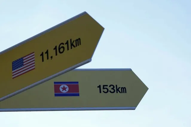 Destination signs to North Korea's capital Pyongyang and the United States, are seen at the Imjingak Pavilion in Paju, near the border with North Korea, South Korea, Friday, January 14, 2022. North Korea on Friday fired two short-range ballistic missiles in its third weapons launch this month, officials in South Korea said, in an apparent reprisal for fresh sanctions imposed by the Biden administration for its continuing test launches. (Photo by Ahn Young-joon/AP Photo)