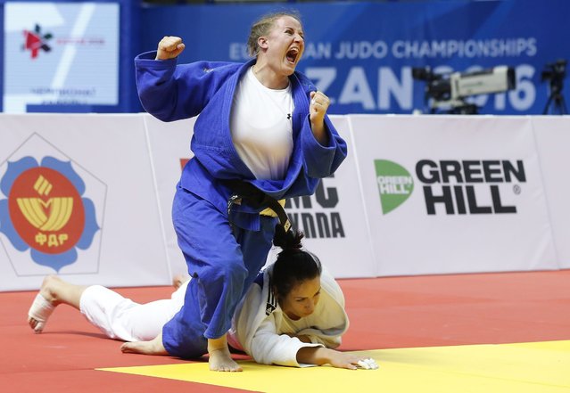 Katarzyna Furmanek of Poland  (blue)celebrates her victory over Ksenia Chibisova of Russia and Poland team victory over Russian team in the women's team final match at the European Judo Championships at the TatNeft Arena in Kazan, Russia, 24 April 2016. (Photo by Maxim Shipenkov/EPA)