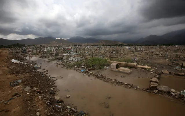 View of a damaged cementery after rainfall and flood in Laredo district of Trujillo, northern Peru, March 15, 2017. (Photo by Douglas Juarez/Reuters)