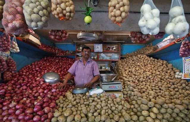 A vendor waits for customers at his vegetable stall at a wholesale fruit and vegetable market in Mumbai, India, February 13, 2017. (Photo by Shailesh Andrade/Reuters)