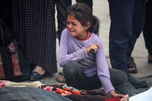 Relatives are mourning over the bodies of people killed in an Israeli airstrike at a UN school housing displaced Palestinians in Nuseirat, at a hospital ground in Deir el-Balah, on June 6, 2024, amid the ongoing conflict between Israel and the Hamas militant group. A hospital in Gaza is saying on June 6 the death toll from an Israeli airstrike on a UN school, which the military is saying housed a “Hamas compound”, has risen to 37. (Photo by Majdi Fathi/NurPhoto/Rex Features/Shutterstock)