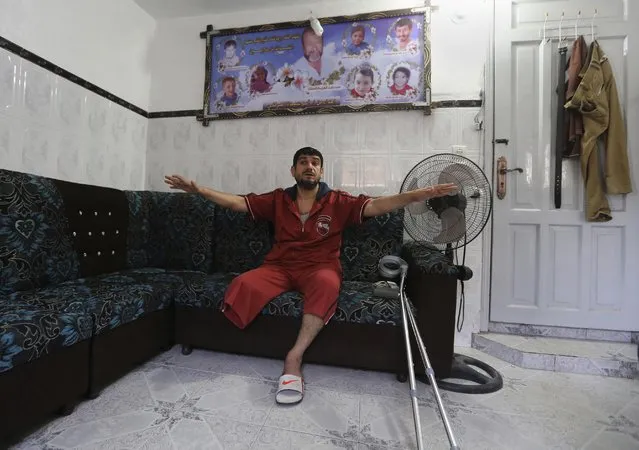 In this Saturday, June 27, 2015 photo, Mohammed al-Selek, 39, gives an interview to The Associated Press at his family house in the Shijaiyah neighborhood of Gaza City, northern Gaza Strip. Al-Selek's life changed forever last July 30, when Israeli mortar shells slammed into his home in an overcrowded Gaza neighborhood, killing all his three children, his father and six other relatives. (Photo by Adel Hana/AP Photo)