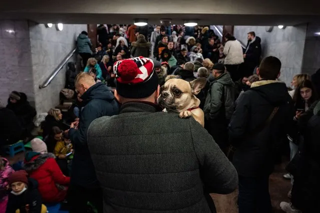 Hundreds of people, including many women and children take shelter inside a metro station as explosions are heard in downtown Kharkiv, Ukraine, Thursday, February 24, 2022. (Photo by Salwan Georges/The Washington Post)