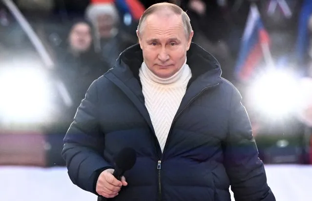 Russian President Vladimir Putin attends a concert marking the 8th anniversary of Crimea's reunification with Russia at the Luzhniki stadium in Moscow, Russia, 18 March 2022. Russia in 2014 annexed the Black Sea peninsula, shortly after Crimeans voted in a disputed referendum to secede from Ukraine. (Photo by Sergei Guneyev/Sputnik/Pool/EPA/EFE)