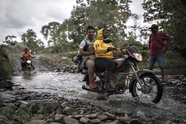 Moto taxis transport migrants to Las Tecas camp from where they will start walking across the Darien gap from Colombia to Panama in hopes of reaching the US, in Acandi, Colombia, Monday, May 8, 2023. (Photo by Ivan Valencia/AP Photo)