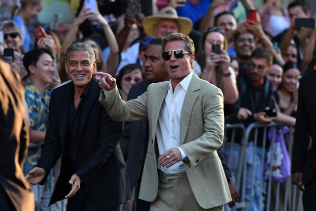 Actors George Clooney (L) and Brad Pitt arrive for the premiere of Apple's “Wolfs” at TCL Chinese Theatre in Hollywood, California, on September 18, 2024. (Photo by Valerie Macon/AFP Photo)