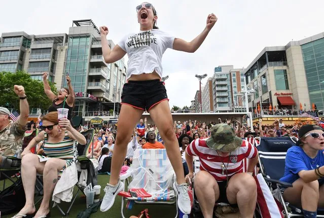 Taleen Khleifat, 20, center, of McLean, Va., cheers the second goal by the United States women’s soccer team against the Netherlands during a World Cup watch party at National Harbor, Md. on July 7, 2019. (Photo by Matt McClain/The Washington Post)