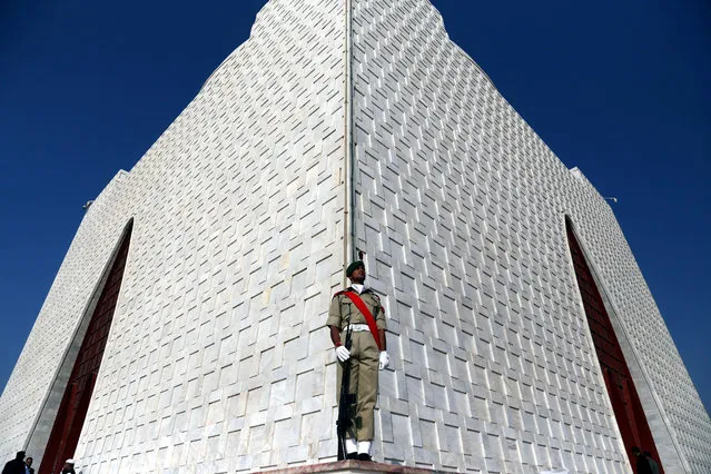 A Pakistani soldier stands during a guard mounting ceremony for the father and founder of the nation, Quaid-e-Azam Mohammad Ali Jinnah, to mark his birth anniversary, in the southern port city of Karachi, Pakistan, 25 December 2019. The ceremony, held by Pakistan Military Academy cadets, is an annual feature that pays homage to the father of the nation. (Photo by Rehan Khan/EPA/EFE)