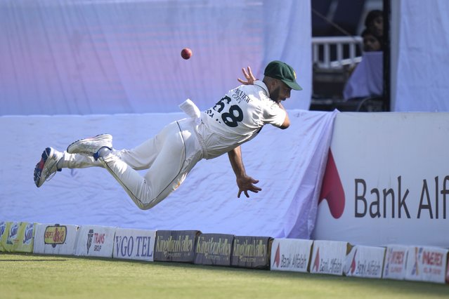 Pakistan's Sajid Khan attempts to take a catch of England's Jamie Smith on the boundary edge during the day one of third test cricket match between Pakistan and England, in Rawalpindi, Pakistan, Thursday, October 24, 2024. (Photo by Anjum Naveed/AP Photo)