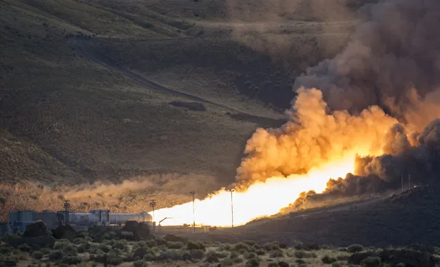 The second and final qualification motor (QM-2) test for the Space Launch System's booster is seen, Tuesday, June 28, 2016, at Orbital ATK Propulsion Systems test facilities in Promontory, Utah. (Photo by Bill Ingalls/NASA via AP Photo)