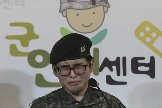South Korean army Sergeant Byun Hui-su weeps during a press conference at the Center for Military Human Right Korea in Seoul, South Korea, Wednesday, January 22, 2020. South Korea's military decided Wednesday to discharge Byun who recently undertook gender reassignment surgery, a ruling expected to draw strong criticism from human rights groups.The sign reads “The Center for Military Human Right Korea”. (Photo by Ahn Young-joon/AP Photo)
