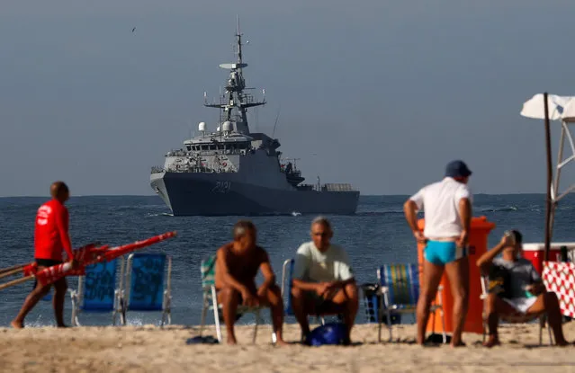 A Brazilian Navy ship attends a patrolling exercise near Copacabana beach ahead of the 2016 Rio Olympics in Rio de Janeiro, Brazil, July 9, 2016. (Photo by Sergio Moraes/Reuters)