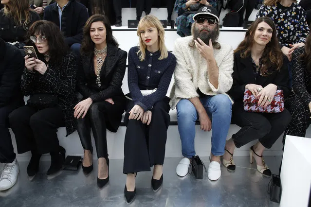 From left, actresses Isabelle Asjani, Anna Mouglalis, singer Angele, Sebastien Tellier and Amandine de la Richardiere pose for photographers prior to the Chanel fashion collection during Women's fashion week Fall/Winter 2020/21 presented Tuesday, March 3, 2020 in Paris. (Photo by Thibault Camus/AP Photo)