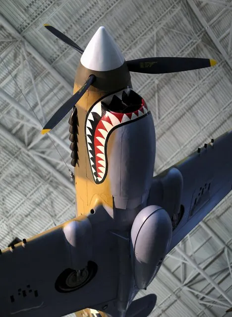 A Curtis P-40 Flying Tiger WWII vintage fighter aircraft is seen at the Udvar-Hazy Smithsonian National Air and Space Annex Museum in Chantilly, Virginia August 28, 2015. (Photo by Gary Cameron/Reuters)