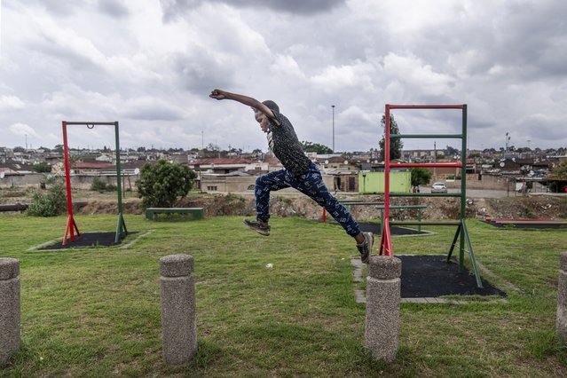 A South African child plays along the banks of the Juksei river in the heart of Alexandra township during the southern hemisphere summer recess, in Johannesburg, South Africa, Wednesday, November 27, 2024. (Photo by Jerome Delay/AP Photo)