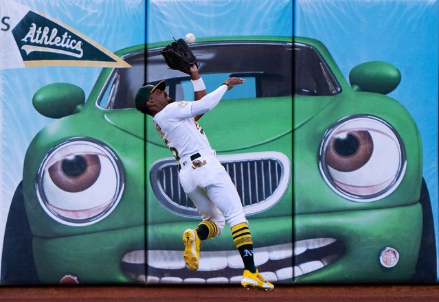 Oakland Athletics left fielder Tony Kemp (5) catches the ball during the first inning against the Miami Marlins at RingCentral Coliseum in Oakland, California on August 22, 2022. (Photo by Stan Szeto/USA TODAY Sports)