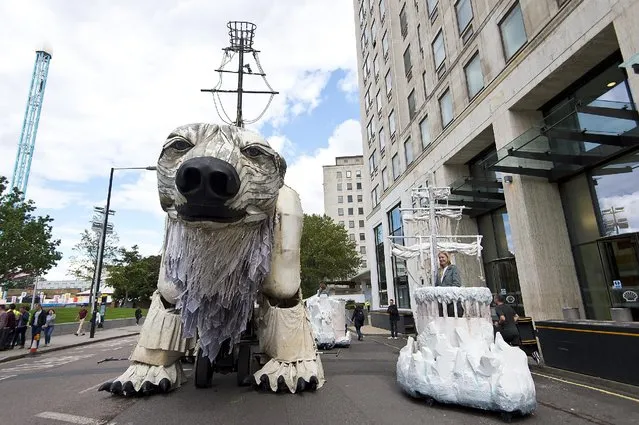 A general view of the giant polar bear puppet outside the Shell Building on September 2, 2015 in London, England. As part of the protest, 64 activists and puppeteers manoeuvred a giant polar bear puppet the size of a double decker bus to rest just metres away from Shell's front entrance. It's intended the polar bear titan will remain fixed there until Shell's Arctic drilling window ends later this month. (Photo by Ben Pruchnie/Getty Images)