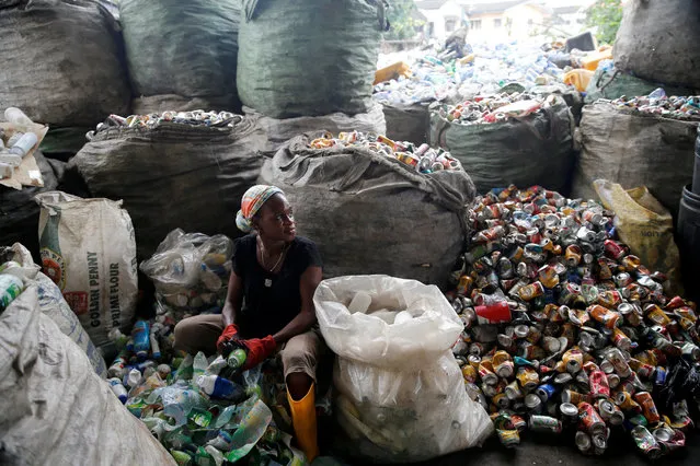 A woman sorts waste at the Wecycler waste recycling  centre in Ebutte Meta district in Lagos, Nigeria July 28, 2016. (Photo by Akintunde Akinleye/Reuters)