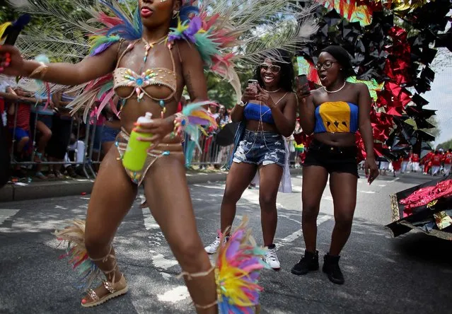 Revelers participate in the annual West Indian Day parade in Brooklyn, on September 1, 2014. The parade, which draws a crowd of a million plus, celebrates Caribbean culture. (Photo by Yana Paskova/Getty Images)