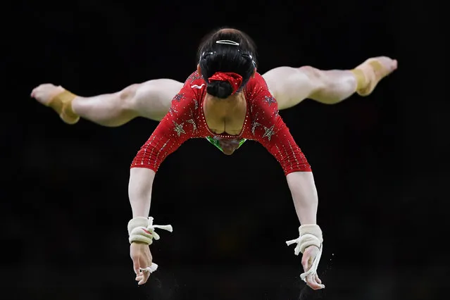 Jiaxin Tan of China competes on the uneven bars during Women's qualification for Artistic Gymnatics on Day 2 of the Rio 2016 Olympic Games at the Rio Olympic Arena on August 7, 2016 in Rio de Janeiro, Brazil. (Photo by David Ramos/Getty Images)