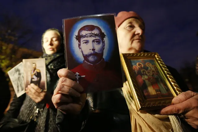 Orthodox believers hold photographs and drawings of Nicholas II of Russia in protest against “Matilda”, a film directed by Alexei Uchitel and premiered at the Mariinsky Theatre in St Petersburg, Russia on October 23, 2017. (Photo by Alexander Demianchuk/TASS)