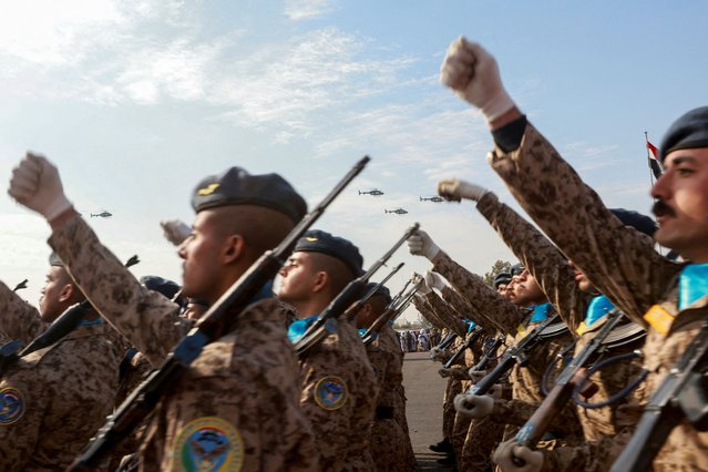 Iraqi army helicopters fly in formation as soldiers march during a military parade to celebrate the 104th anniversary of the founding of the Iraqi army at the Camp Taji military base on the outskirts of Baghdad, Iraq on January 6, 2025. (Photo by Ahmed Saad/Reuters)