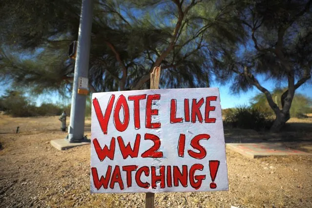 A hand-written sign reads “Vote Like WW2 Is Watching” ahead of the mid-term elections in Tuscon, Arizona, U.S., November 6, 2022. (Photo by Brian Snyder/Reuters)