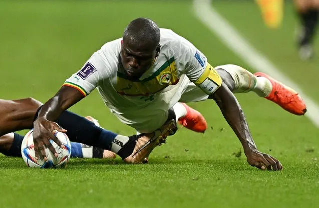 Senegal's defender #03 Kalidou Koulibaly during the Qatar 2022 World Cup Group A football match between Ecuador and Senegal at the Khalifa International Stadium in Doha on November 29, 2022. (Photo by Dylan Martinez/Reuters)