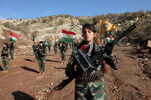 Female Kurdish Peshmerga fighters affiliated with Iran's separatist Kurdistan Freedom Party (PAK), are pictured at a base in an undisclosed location in the Arbil province, the capital of the autonomous Kurdish region of northern Iraq, on December 1, 2022. Iranian-Kurdish rebel groups have for decades sought refuge in northern Iraq's autonomous Kurdistan region, but they have recently come under fresh fire amid weeks of protests in the neighbouring Islamic republic. (Photo by Safin Hamed/AFP Photo)