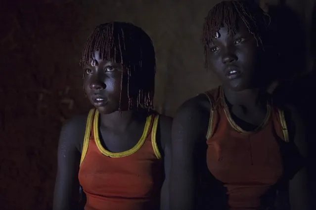 Pokot girls wait together in a home before their circumcision ceremony in a village about 80 kilometres from the town of Marigat in Baringo County, October 16, 2014. (Photo by Siegfried Modola/Reuters)