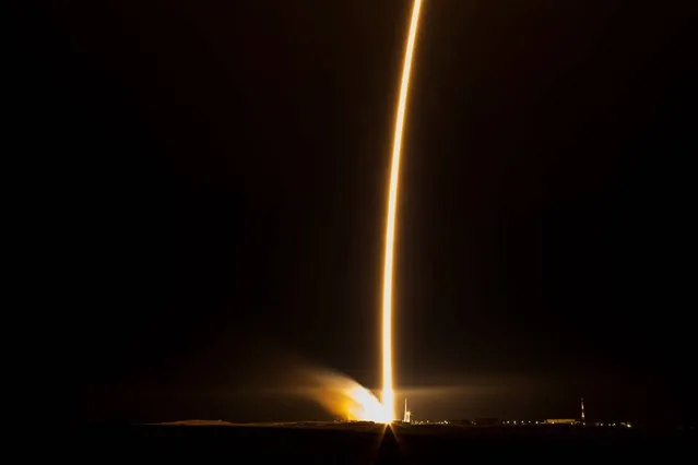 The Soyuz-FG rocket booster with Soyuz TMA-15M space ship carrying a new crew to the International Space Station, ISS, blasts off at the Russian leased Baikonur cosmodrome, Kazakhstan, Monday, November 24, 2014. The Russian rocket carries United States astronaut Terry Virts, Russian cosmonaut Anton Shkaplerov and Italian astronaut Samantha Cristoforetti. (Photo by Aubrey Gemignani/AP Photo/NASA)