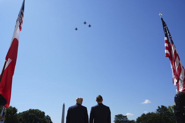 President Donald Trump and Polish President Karol Nawrocki watch a military aircraft flyover at the White House, Wednesday, September 3, 2025, in Washington. The Washington Monument stands in the distance. (Photo by Evan Vucci/AP Photo)
