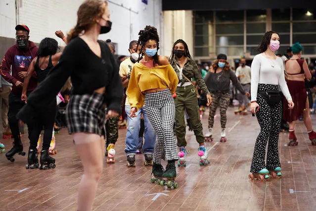 People skate during “The Roller Wave” skating event at Greenpoint Terminal Market on Saturday, November 21, 2020 in Brooklyn, N.Y. (Photo by James Keivom/The New York Post)