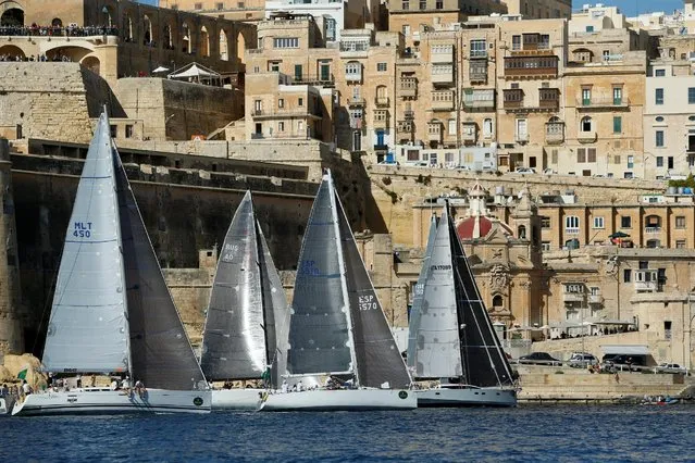 Sailing boats jostle for position at the start of the Rolex Middle Sea Race in Valletta's Grand Harbour, Malta, October 22, 2016. The 608 nautical mile offshore classic takes boats from Malta, round Sicily and Lampedusa, and back. (Photo by Darrin Zammit Lupi/Reuters)