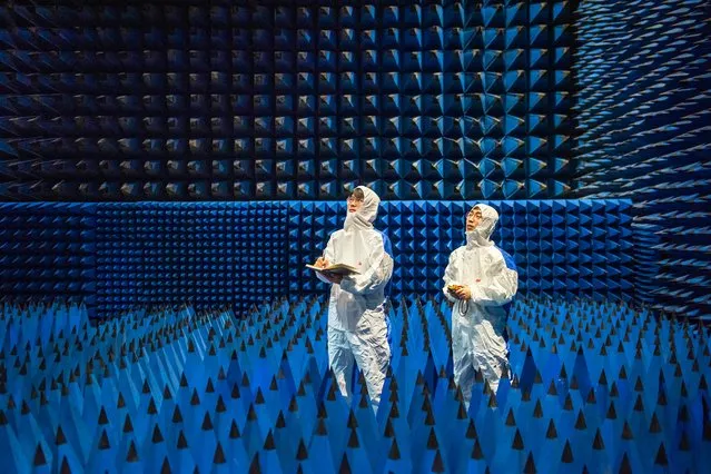 This photo taken on April 20, 2023 shows technicians testing a new material at a company in Ningbo, in China's eastern Zhejiang province. (Photo by AFP Photo/China Stringer Network)