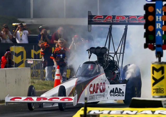 NHRA Top Fuel driver Steve Torrence burns out prior to making his first qualifying run during the Menards NHRA Heartland Nationals on Friday, May 18, 2018, at Heartland Motorsports Park in Topeka, Kan. Torrence ended the night as the top qualifier. (Photo by Chris Neal/The Capital-Journal via AP Photo)