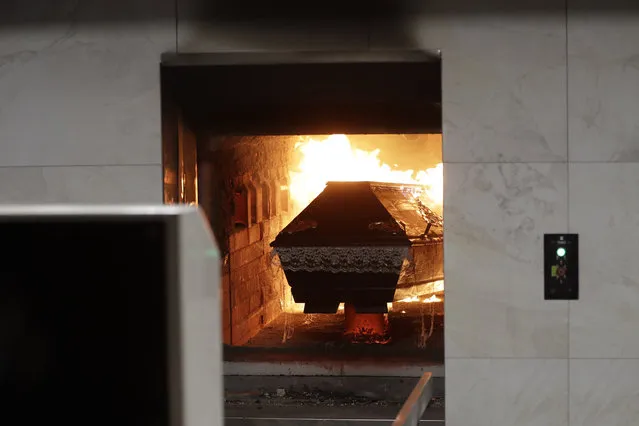 A casket is incinerated at a crematorium in Ostrava, Czech Republic, Thursday, January 7, 2021. The biggest crematorium in the Czech Republic has been overwhelmed by mounting numbers of pandemic victims. With new confirmed COVID-19 infections around record highs, the situation looks set to worsen. Authorities in the northeastern city of Ostrava have been speeding up plans to build a fourth furnace but, in the meantime, have sought help from the government’s central crisis committee for pandemic coordination. (Photo by Petr David Josek/AP Photo)