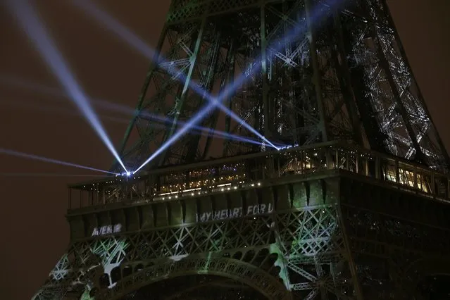 The Eiffel Tower is lit in green ahead of the World Climate Change Conference 2015 (COP21), in Paris, France, November 29, 2015. (Photo by Benoit Tessier/Reuters)