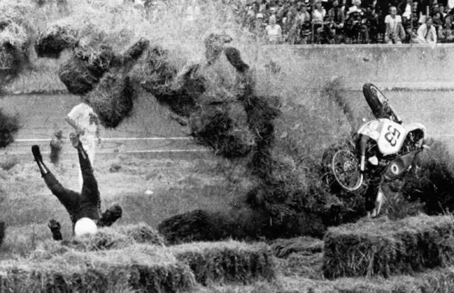 Nicholas Richichi of Fresh Meadows, New York flies upside down after hitting the retaining walls of hay at the Daytona International Speedway during the running of the 39th Annual Daytona 200 Motorcycle Classic in Daytona Beach, Florida on March 9, 1980. There has been no report on injuries to Richichi. The race was stopped afterward because of rain. (Photo by AP Photo/RS)