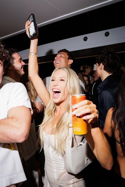 Guests stepped out in style as SipMARGS and Alix Earle hosted a vibrant celebration during Art Basel Miami, bringing together influencers, artists, and creators for a night of cocktails, color, and cultural buzz on December 6, 2025. Pictured: American social media personality Alix Earle. (Photo by Backgrid USA)