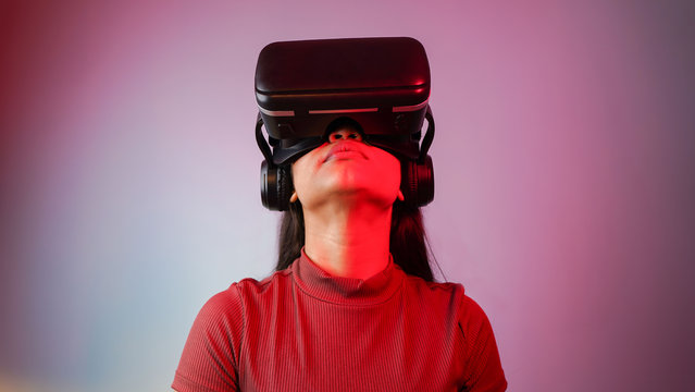 Young Asian Indian woman wearing virtual reality headset, a girl with VR glasses concept studio portrait. (Photo by Arnav Pratap Singh/Getty Images)