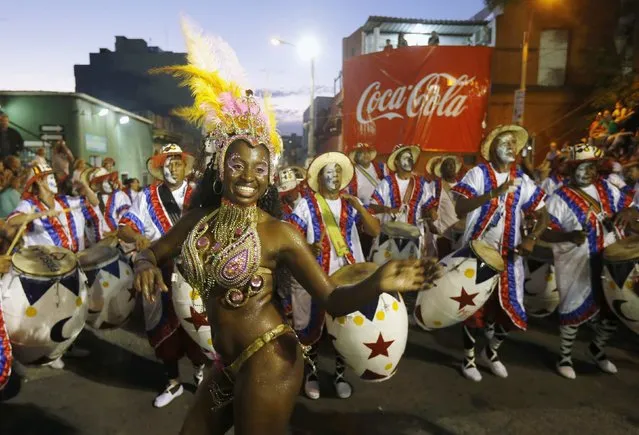 Members of a comparsa, a Uruguayan carnival group, dance during the Llamadas parade in Montevideo February 5, 2015. (Photo by Andres Stapff/Reuters)